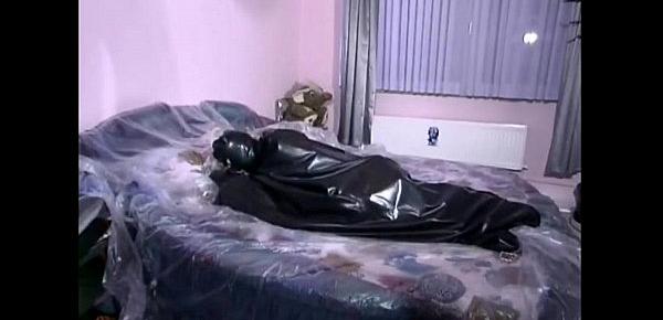  Couple in latex outfits fucking on bed